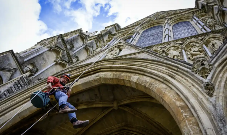 ‘It’s quite a commute’: climbers scale Salisbury Cathedral to repair stonework | Heritage | The Guardian